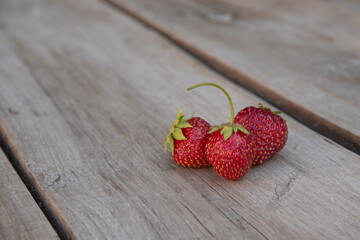 strawberries on wooden background