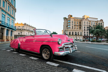 Old American car on streets of capital city of Cuba. Famous tourist attraction, cars from 50s and 60s.