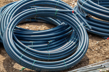 Black PVC hoses with a blue lines