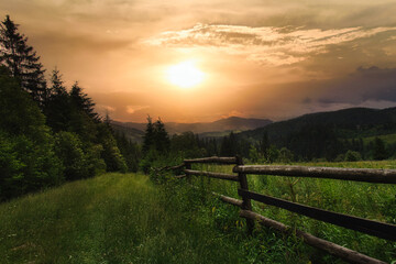 Sunset in the mountains. Mountain path for walking, hiking, sports and recreation
