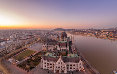 Aerial drone shot of Dome of Hungarian Parliament at dawn before sunrise in Budapest morning