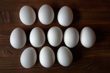 Eggs on a wooden table. View from above.