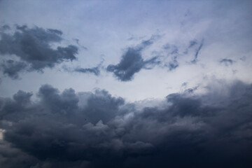 A beautiful stormy sky with clouds. The Dark heavy thunderstorm clouds before the rain. Dramatic cloudscape.