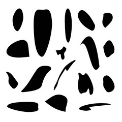 Spots and blots of black gouache on a white background