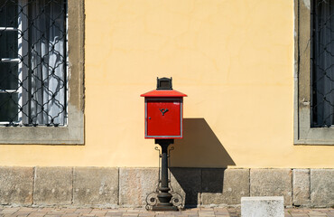 Old red mailbox on the street.