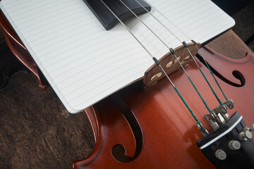 violin body with string and notepad
