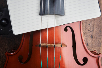 violin with white paper notepad
