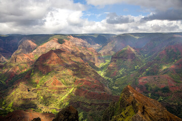Waimea Canyon, also known as the Grand Canyon of the Pacific, is a large canyon, approximately ten miles long and up to 3,000 feet deep, Kauai, Hawaii