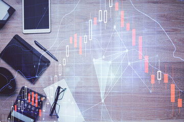 Double exposure of forex graph drawing and work table top veiw. Concept of financial analysis.
