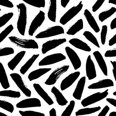 Brush strokes vector seamless pattern. Black paint freehand scribbles, dash lines, dry texture. Chaotic rough smears. Black and white mosaic texture. Hand drawn grunge ink brushstrokes.