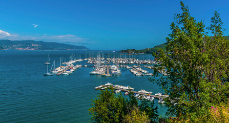 Fototapeta na wymiar A view over the marina of Fezzano from the road to Porto Venere, Italy in the summertime