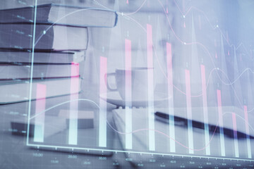 Double exposure of financial chart drawing and desktop with coffee and items on table background. Concept of forex market trading