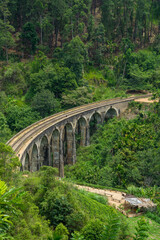 Fototapeta na wymiar Nine arches Bridge in highlands near Ella, Sri Lanka. Jungle and tea plantation all around.