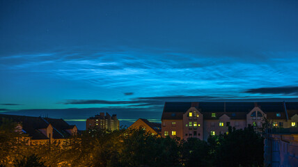 Fototapeta premium Noctilucent clouds above the city Mannheim in Germany, photographed on July 7, 2020.