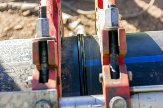 Close up view of the new ending polyethylene pipe weld.