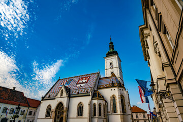 Fototapeta na wymiar St. Mark's Church and the Parliament Palace in Upper Town, Zagreb