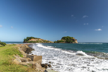 Rolling waves and shore line in Sainte-Marie, Martinique, France
