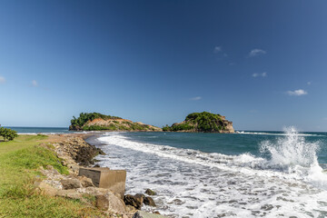 Rolling waves and shore line in Sainte-Marie, Martinique, France