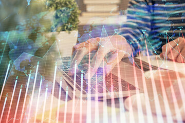 Double exposure of woman hands typing on computer and forex chart hologram drawing. Stock market invest concept.