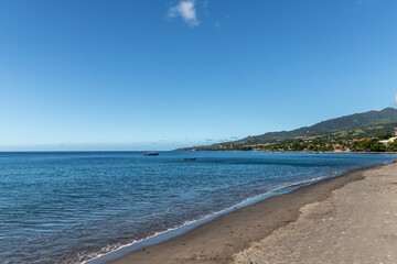 Fototapeta na wymiar Black sand beach in Saint-Pierre, Martinique, France