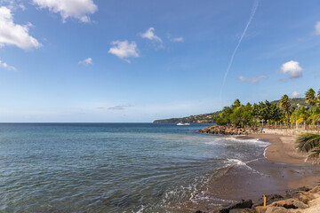 Rolling waves and shore line in Sainte-Luce, Martinique, France