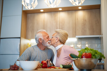 Senior couple cooking healthy food