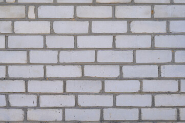 brickwork of white silicate brick in the design of the building, closeup shot