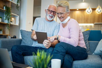 Senior couple shopping on internet