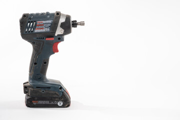 Fototapeta premium Impact Driver drill isolated on a white background with room for copy on the right