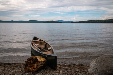 A canoe on a lake in Maine.  - 363389617