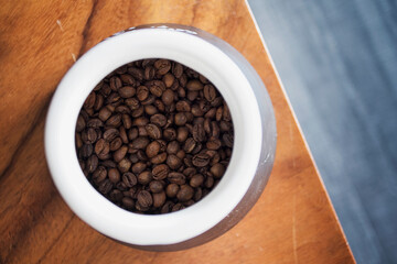 Overview of roasted coffee beans in a jar