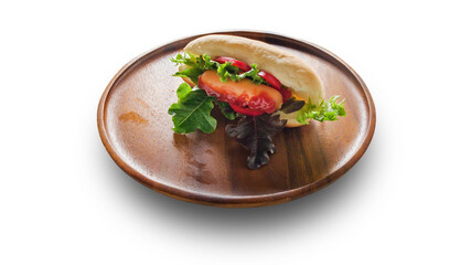 Vegetable sausage and bread on wooden plate