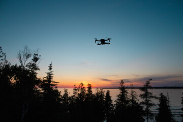 Fototapeta na wymiar Drone Hovering at Sunset