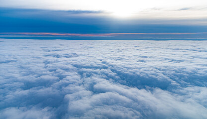 View of clouds above themselves.
