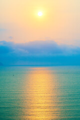 Fototapeta na wymiar Sun over the ocean. Beautiful tropical background.