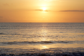 Colorful tropical sunset in famous tourist destination - Bali.