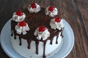 Chocolate pie with whipped cream and cherry