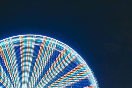 Illuminated Ferris Wheel Against Sky At Night