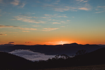 sunrise sky with beautiful clouds rolling over the hills of Tasmania