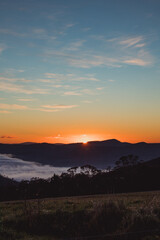 Obraz premium sunrise sky with beautiful clouds rolling over the hills of Tasmania