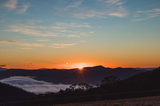 sunrise sky with beautiful clouds rolling over the hills of Tasmania