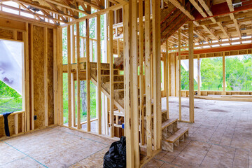 Framing of under construction wooden house building frame structure on new development