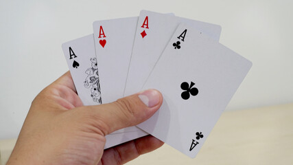 Close-Up of Winning Aces Hand"