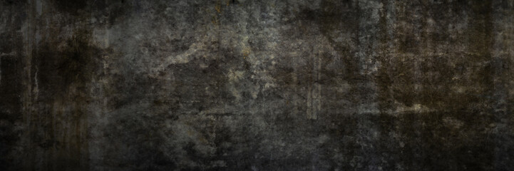 Texture of a grungy black concrete wall as background