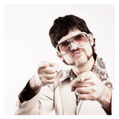 filtered image of a Retro 1970s man in a leisure suit pointing to the camera - vintage photo border