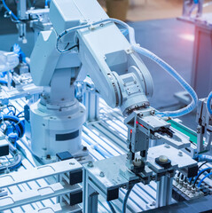robot gripping and smart robot working on smart factory,industry 4.0 and technology.
