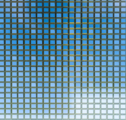 detail of a silicon wafer reflecting different colors.