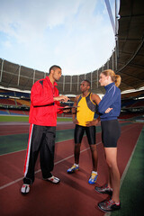 Sports coach giving instruction