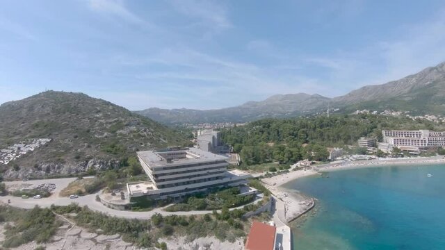 Aerial Drone Footage towards a Abandon Hotel of Kupari Beach, Croatia.