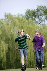 Boys chatting while walking together